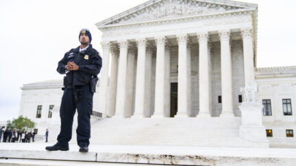 UNITED STATES - OCTOBER 3: A police officer is seen outside of the U.S. Supreme Court as it begins a new term on Monday, October 3, 2022. Members of the public were allowed in to hear the court's arguments that had been closed since March 2020 due to the coronavirus pandemic.